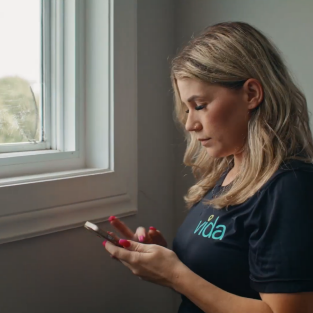 Tiffany Ling produced spot for Amazon Business featuring woman wearing VIDA shirt by a window