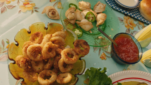 Tiffany Ling produced spot for M&M Foods calamari rings and hors d'oeuvres on a table